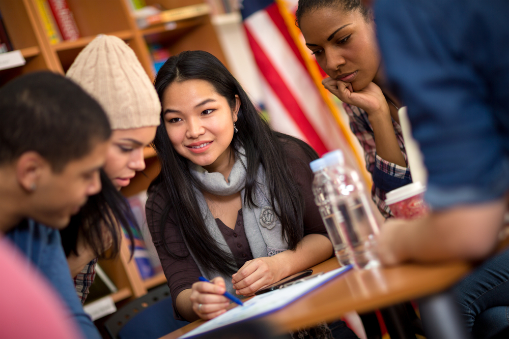 Multi,Ethnic,Group,Of,Students,Working,On,Task,Together